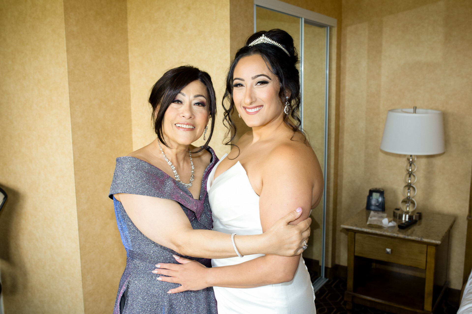 A loving and supportive embrace between Bunkin' and her mother before the ceremony.
