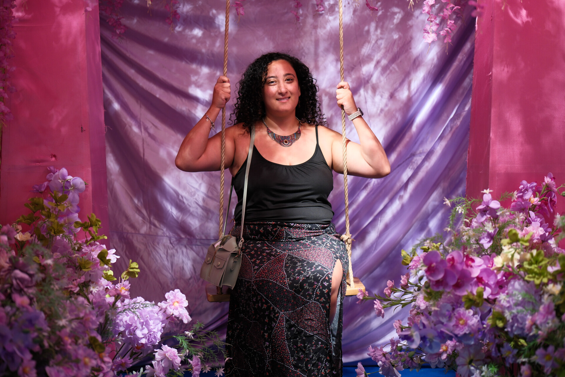 Bunkin' enjoying a whimsical floral swing.