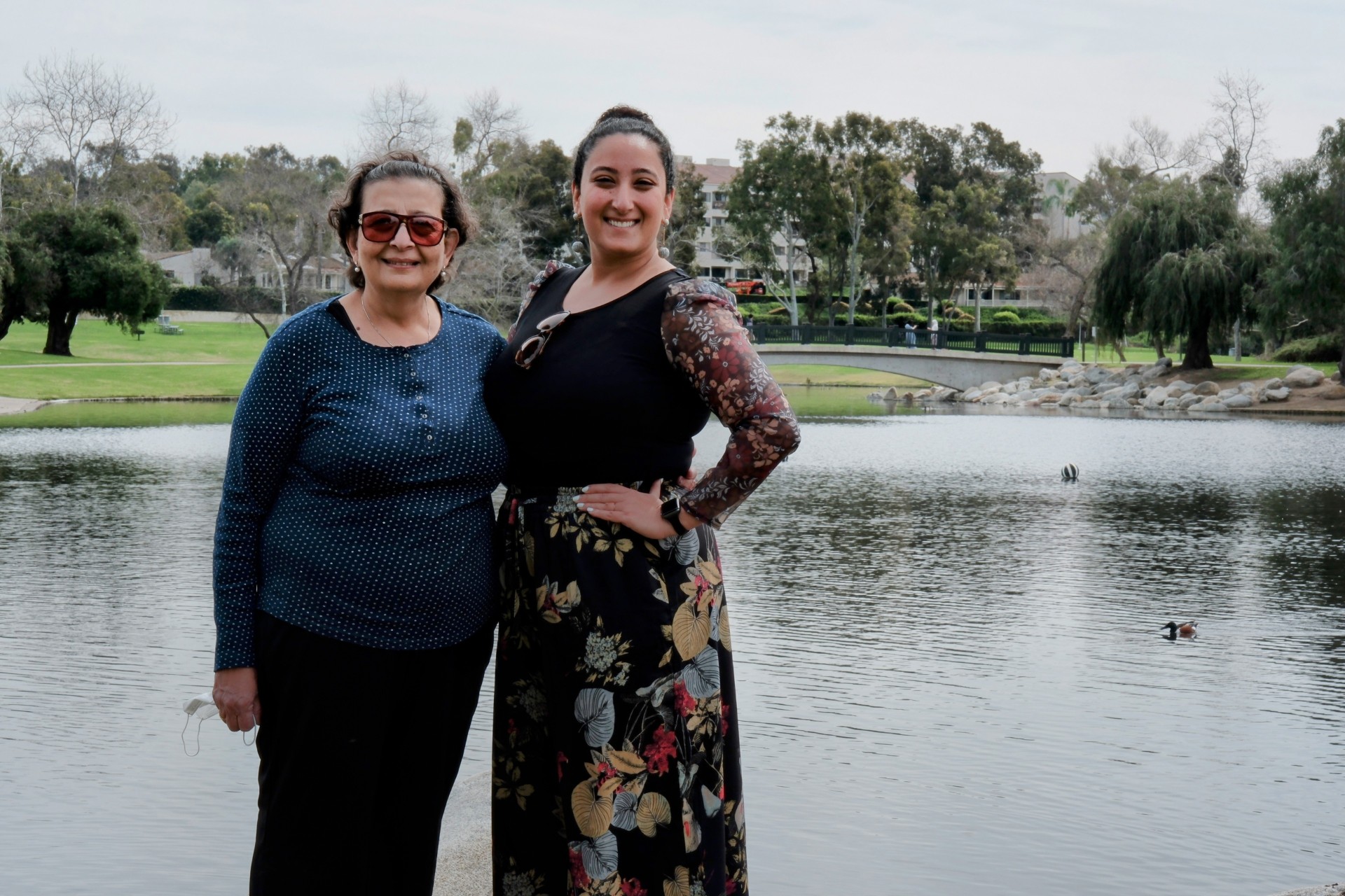A lovely portrait of Bunkin' with her mother, sharing a moment of connection by a serene lake.