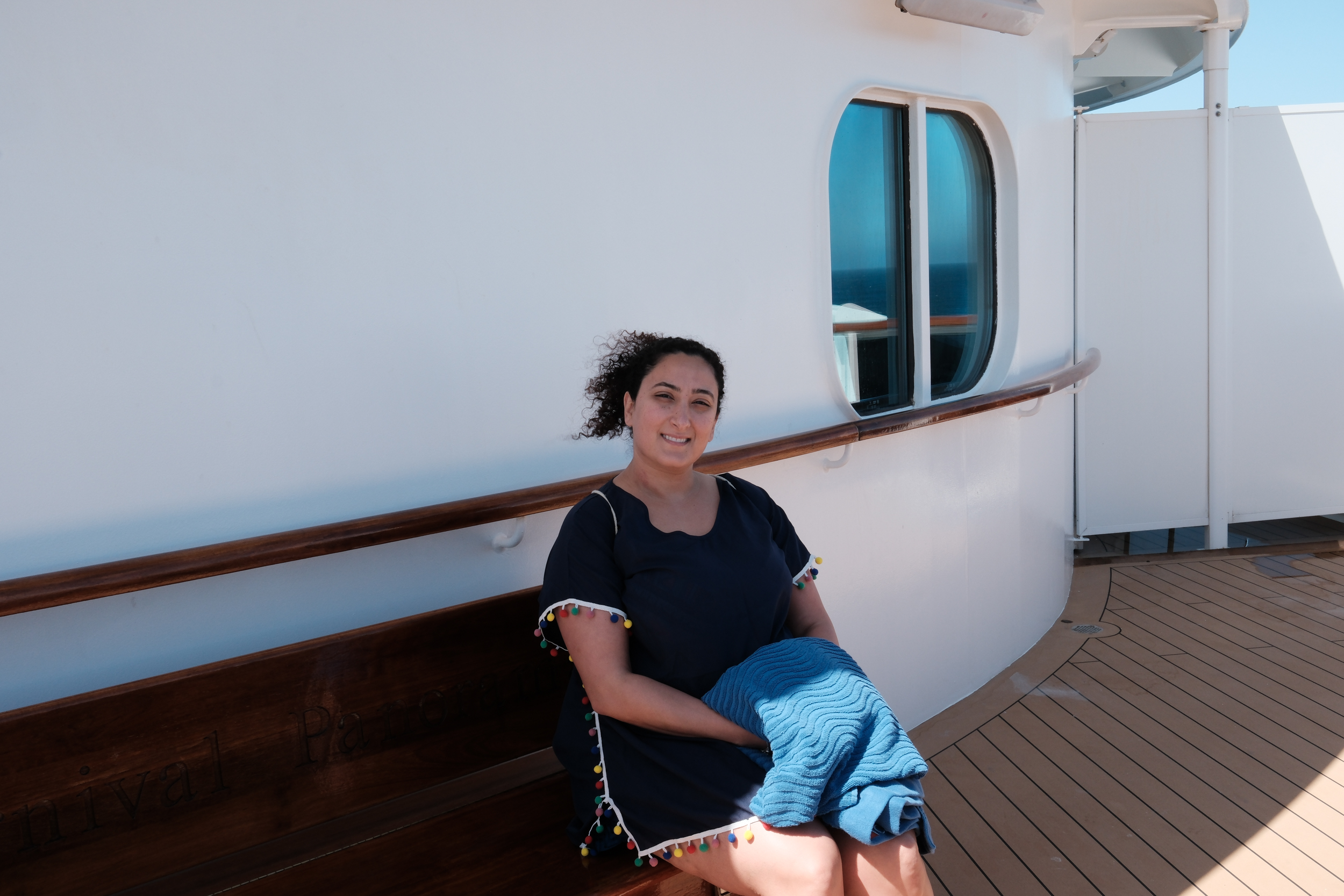 Bunkin' enjoying a sun-drenched, breezy, and joyful moment on the ship's deck.