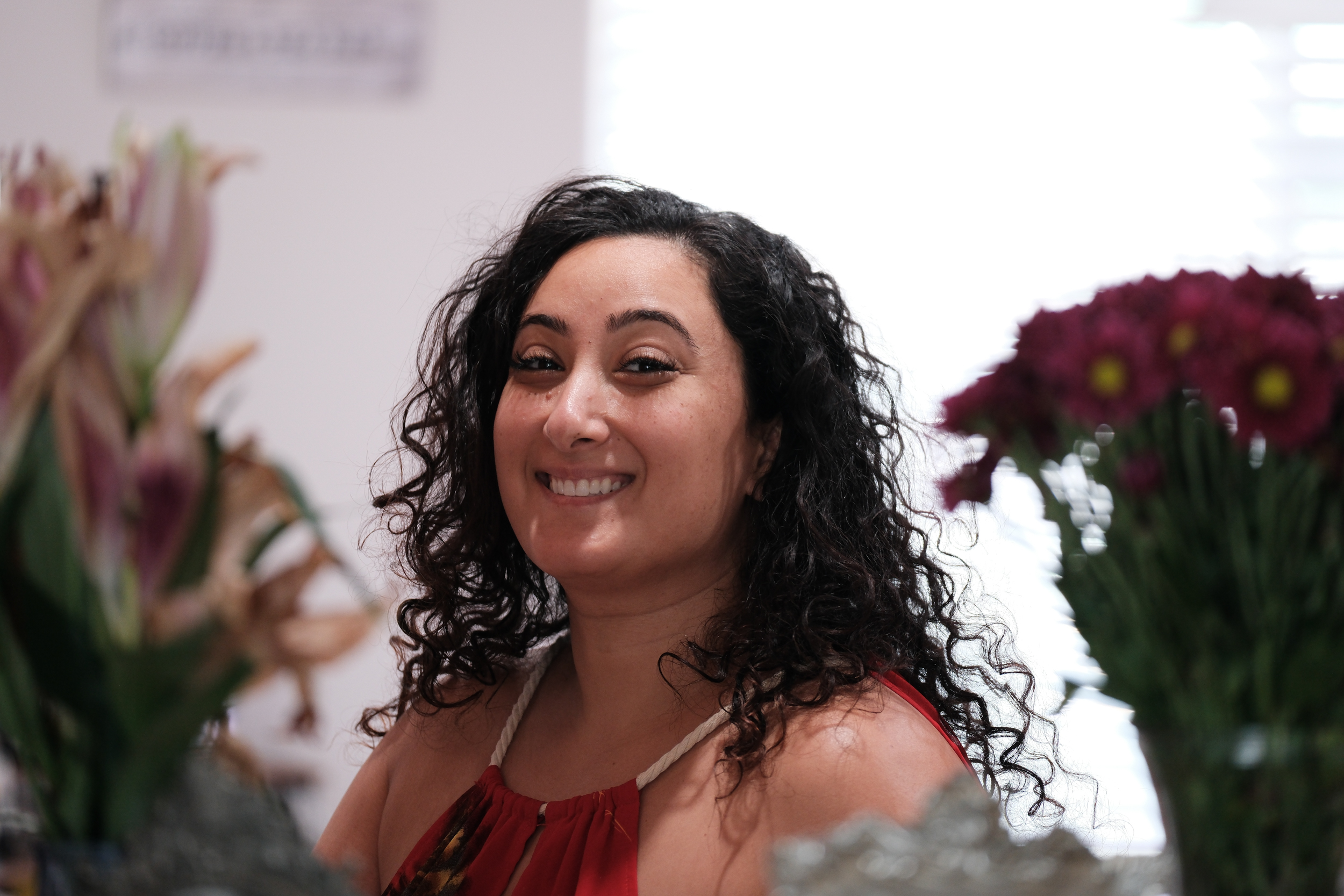 Bunkin's radiant smile, beautifully framed by flowers.