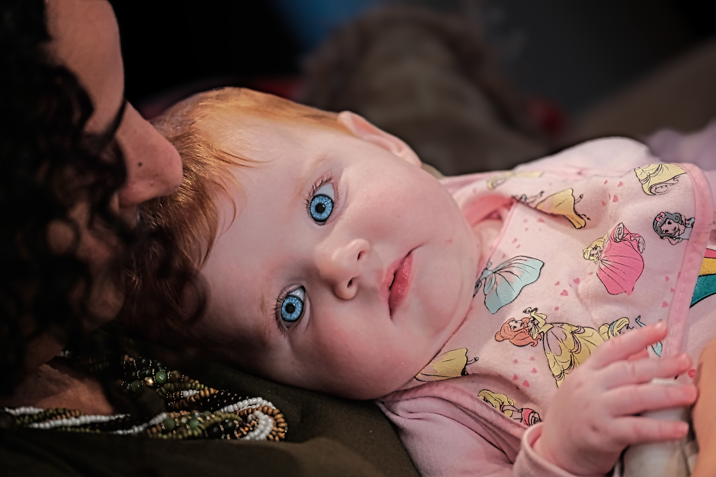 Bunkin' sharing a sweet and loving moment with a beautiful, blue-eyed baby.