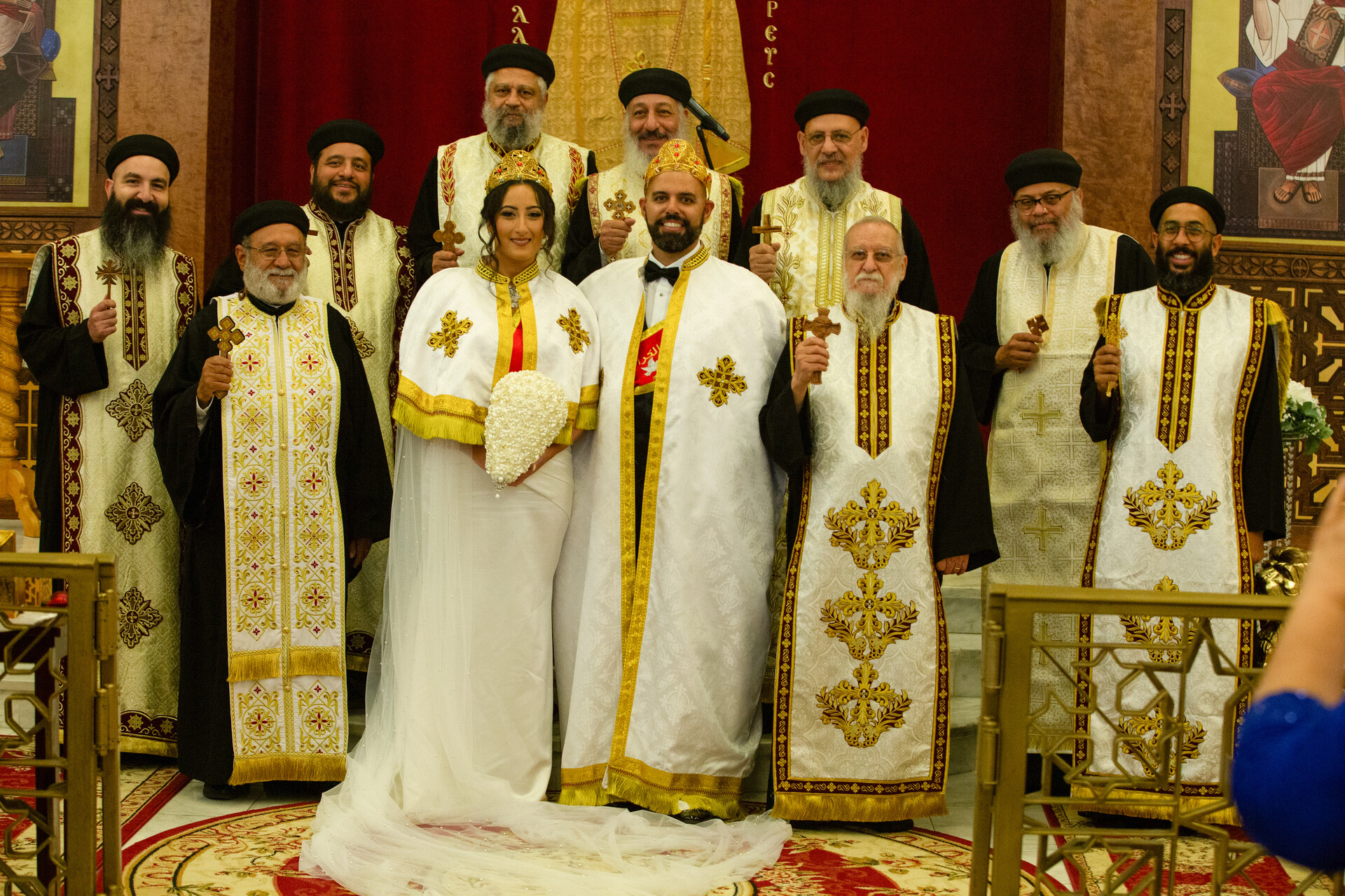 Bunkin' and her consort during the solemn and beautiful wedding ceremony, surrounded by revered Coptic priests.